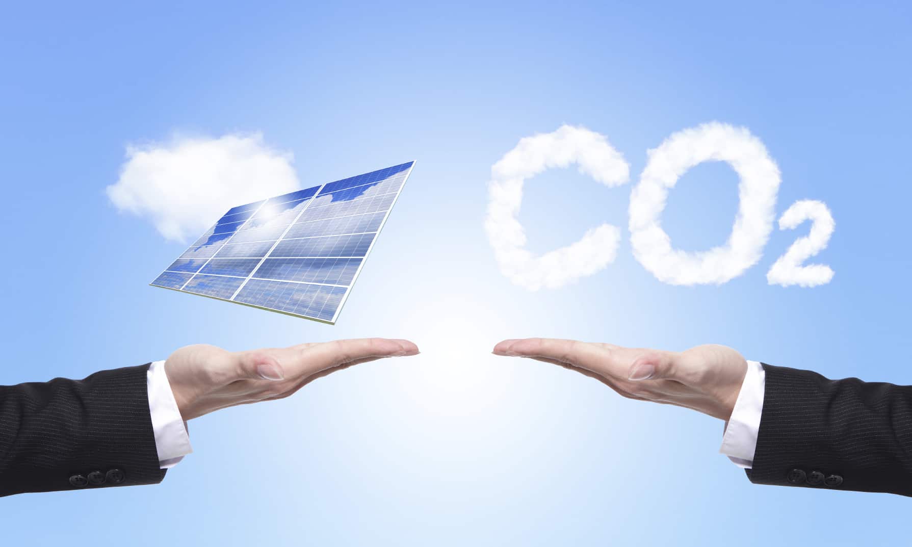 eco concept - choice solar panel or co2, Business man hold Alternative Energy (solar cell ) with blue sky and cloud background